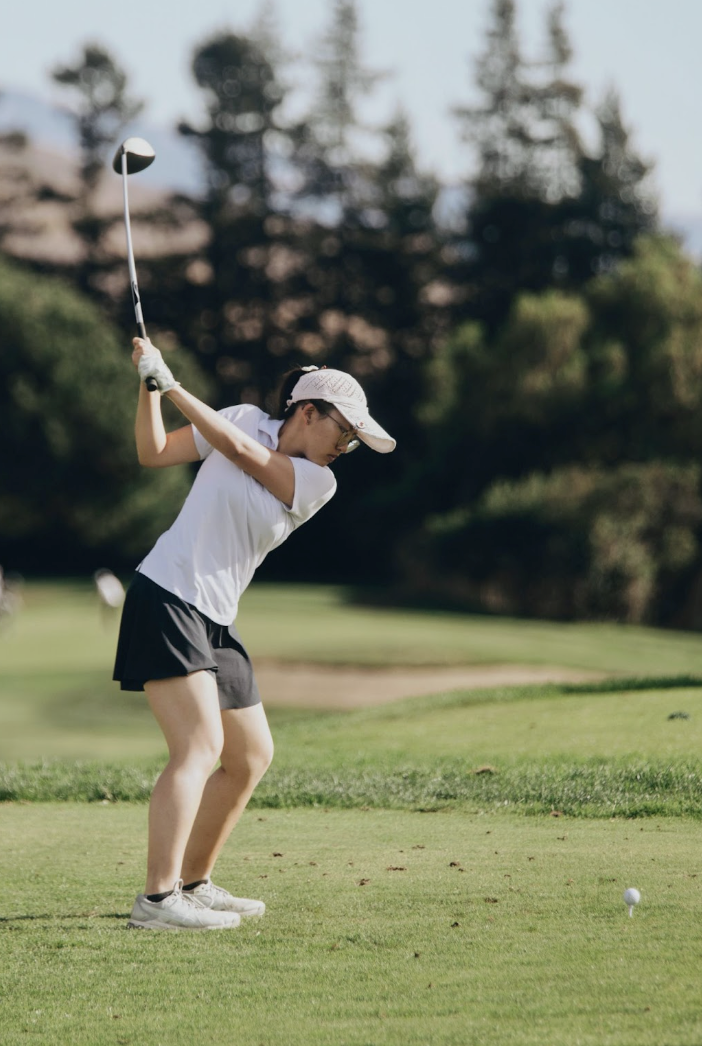 Senior Abby Zhou hits her tee shot with a driver in the game against Monta Vista